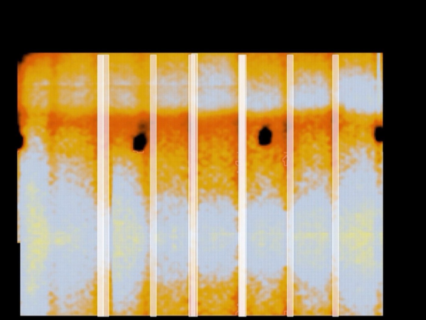 A false-colour thermographic scan of a wall showing vertical stud lines as bright bands and fastener points as dark spots